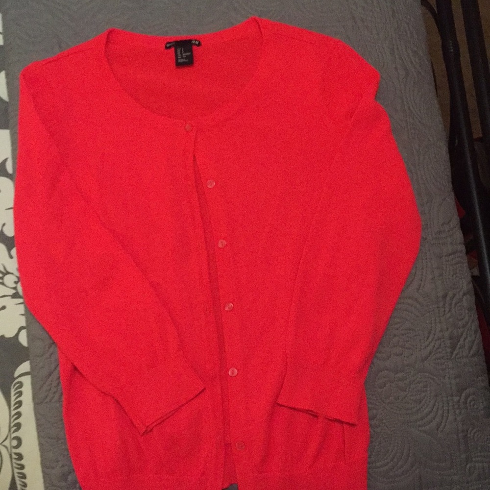 Bright orange sweater